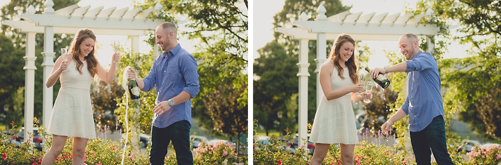 engaged couple pops champagne in rose garden for wedding engagement photography at hotel henry & delaware park in Buffalo, NY