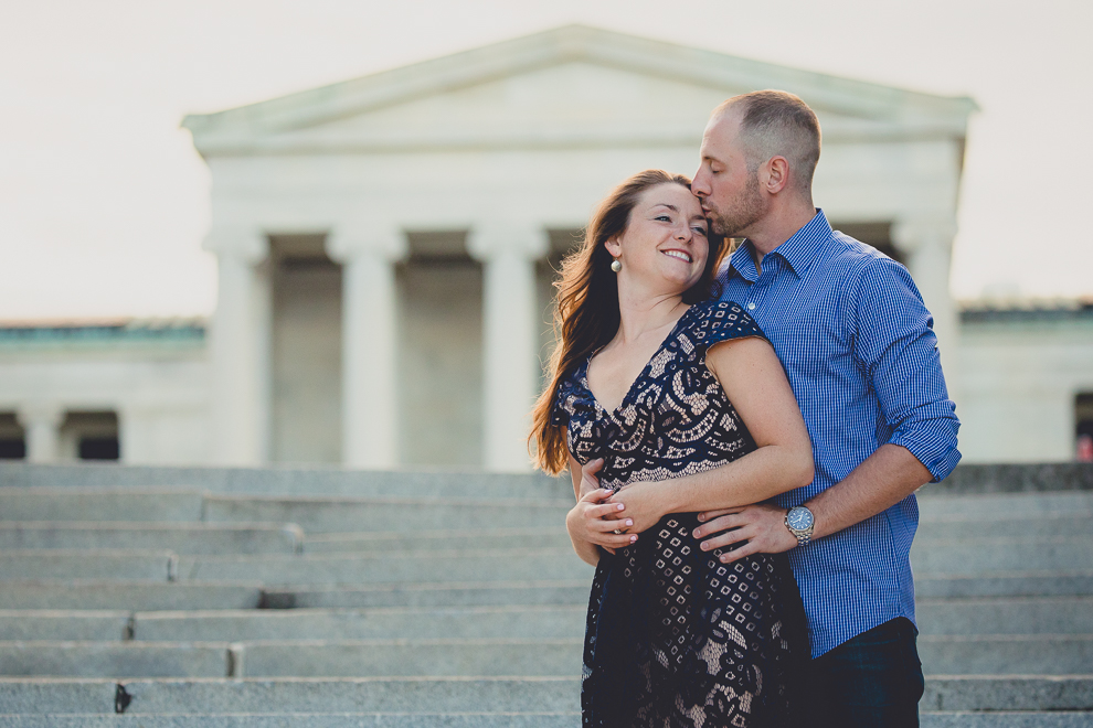 engaged couple stands in front of Albright Knox Art Gallery for engagement photography at hotel henry & delaware park in Buffalo, NY