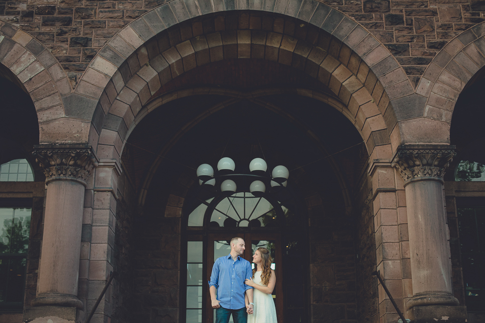 engaged couple gazes at each other for wedding engagement photography at hotel henry & delaware park