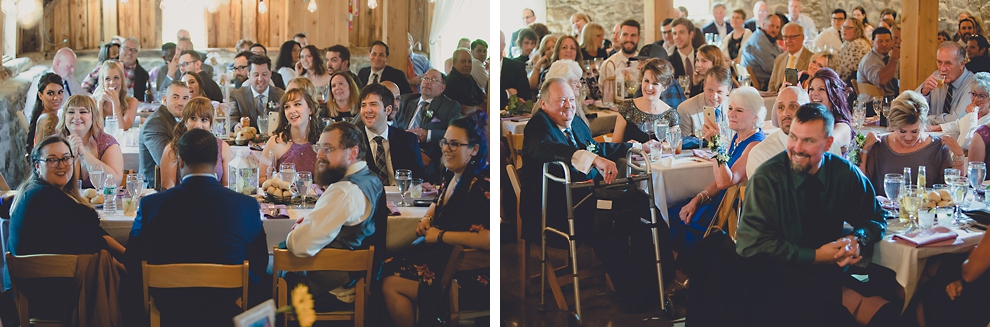 guests smile during speech at wedding reception in barn at a Hayloft in the Grove in East Aurora, near Buffalo, NY