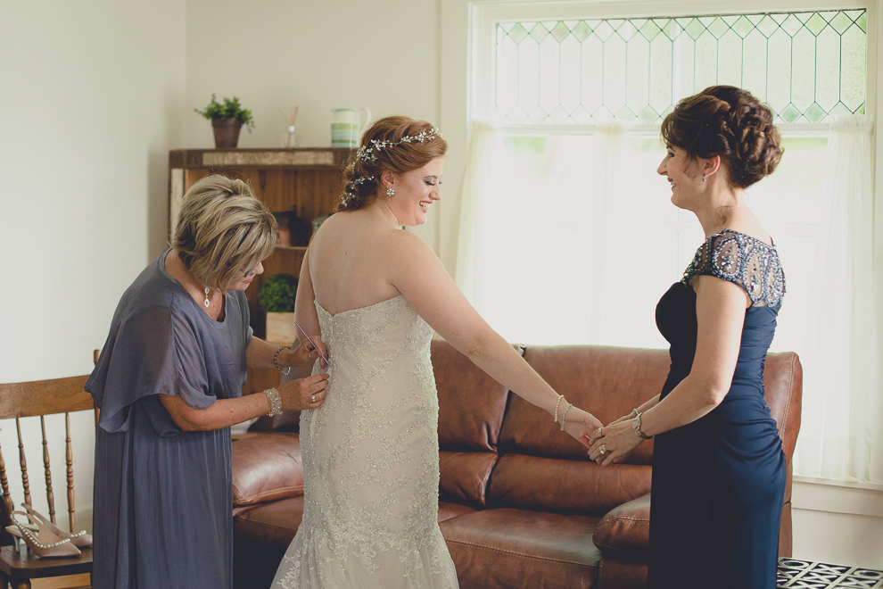 aunt seeing bride dressed for first time in cottage at a Hayloft in the Grove wedding in East Aurora, near Buffalo, NY