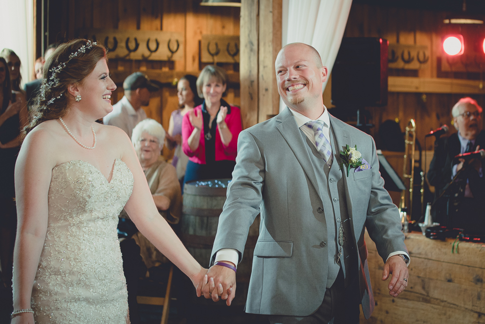 bride and groom dance at wedding reception in barn at a Hayloft in the Grove in East Aurora, near Buffalo, NY