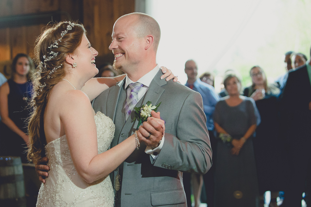 bride and groom dance at wedding reception in barn at a Hayloft in the Grove in East Aurora, near Buffalo, NY