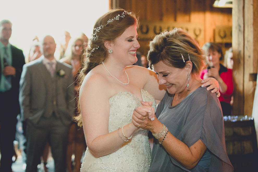 bride and mom dance at wedding reception in barn at a Hayloft in the Grove in East Aurora, near Buffalo, NY