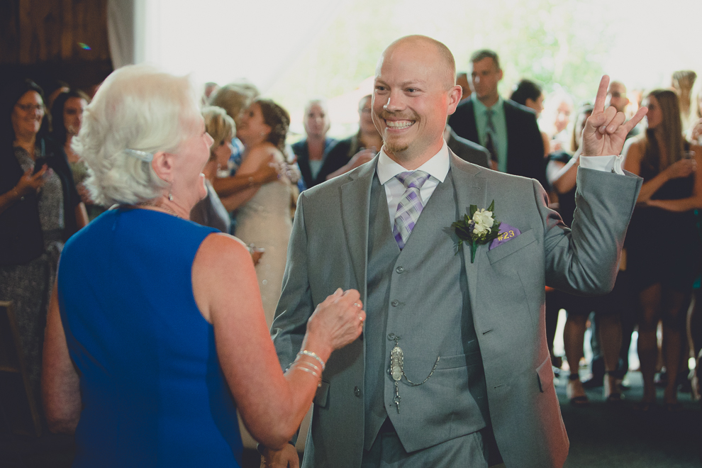 groom and mom dance at wedding reception in barn at a Hayloft in the Grove in East Aurora, near Buffalo, NY