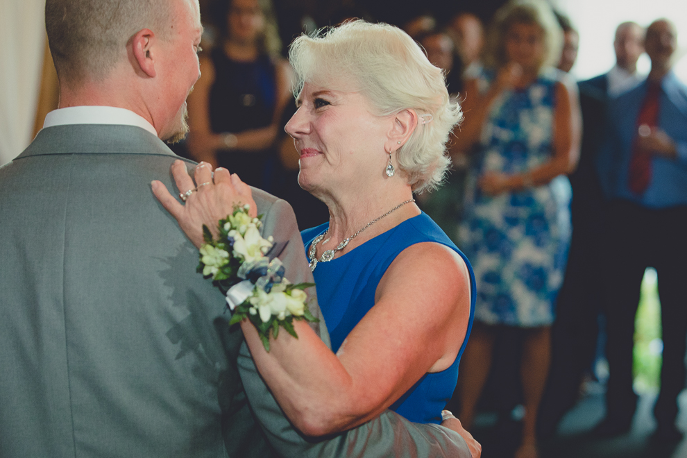 groom and mom dance at wedding reception in barn at a Hayloft in the Grove in East Aurora, near Buffalo, NY