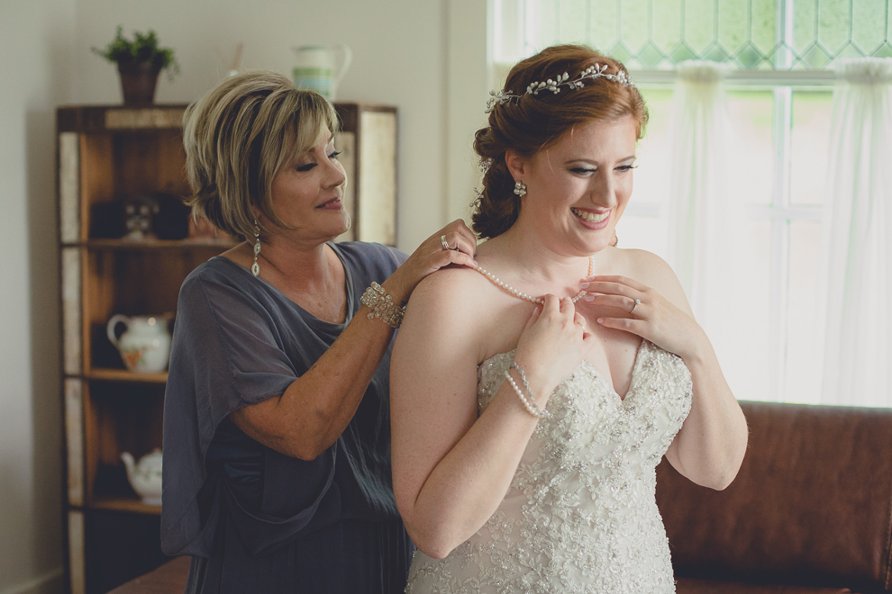 brides getting ready in cottage at a Hayloft in the Grove wedding in East Aurora, near Buffalo, NY