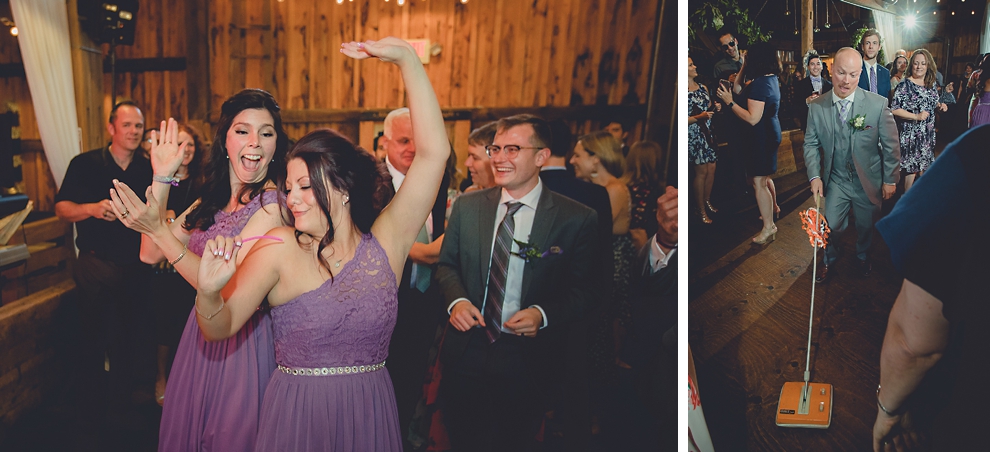 guests dance at wedding reception in barn at a Hayloft in the Grove in East Aurora, near Buffalo, NY