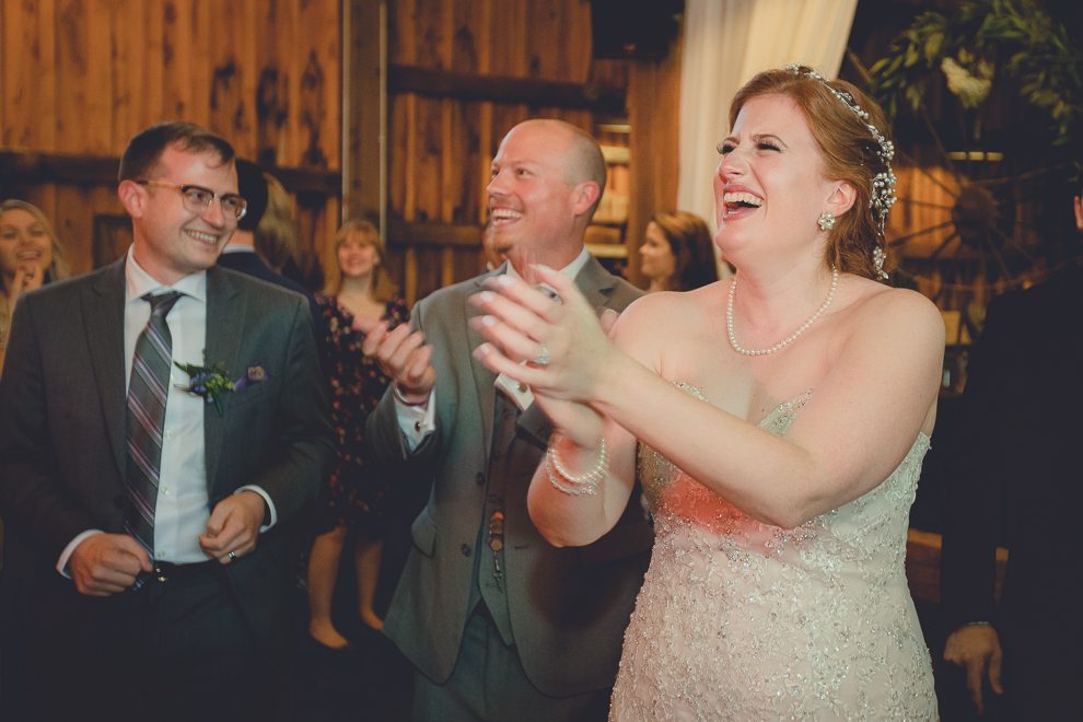 bride and groom dance at wedding reception in barn at a Hayloft in the Grove in East Aurora, near Buffalo, NY