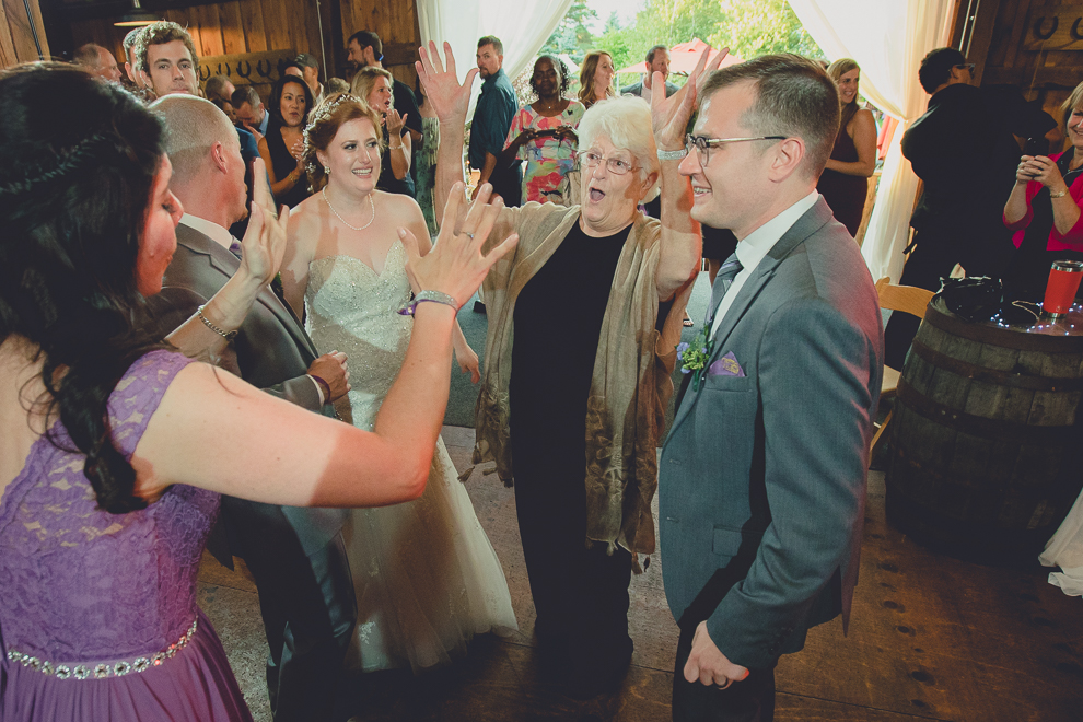 bride and groom dance at wedding reception in barn at a Hayloft in the Grove in East Aurora, near Buffalo, NY