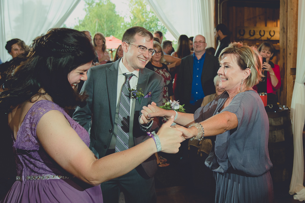 guests dance at wedding reception in barn at a Hayloft in the Grove in East Aurora, near Buffalo, NY