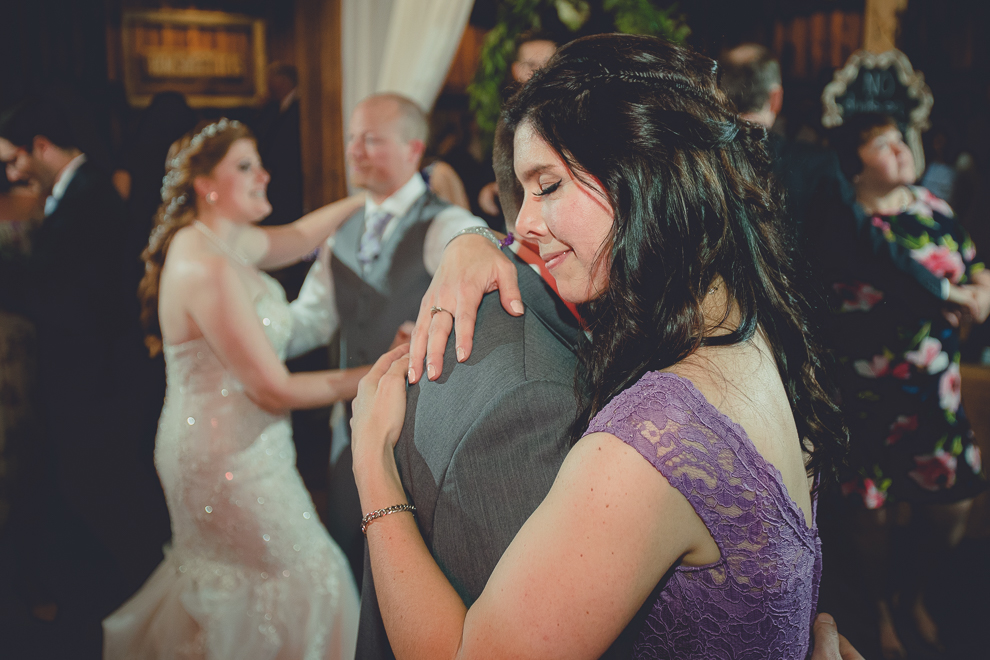guests dance at wedding reception in barn at a Hayloft in the Grove in East Aurora, near Buffalo, NY