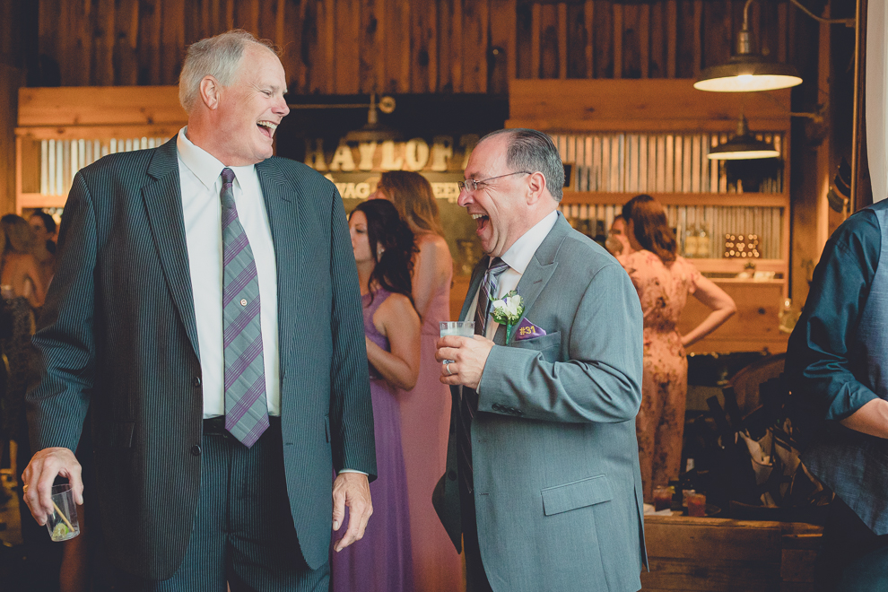 guests dance at wedding reception in barn at a Hayloft in the Grove in East Aurora, near Buffalo, NY