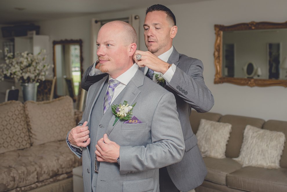 groom getting ready in cottage at a Hayloft in the Grove wedding in East Aurora, near Buffalo, NY