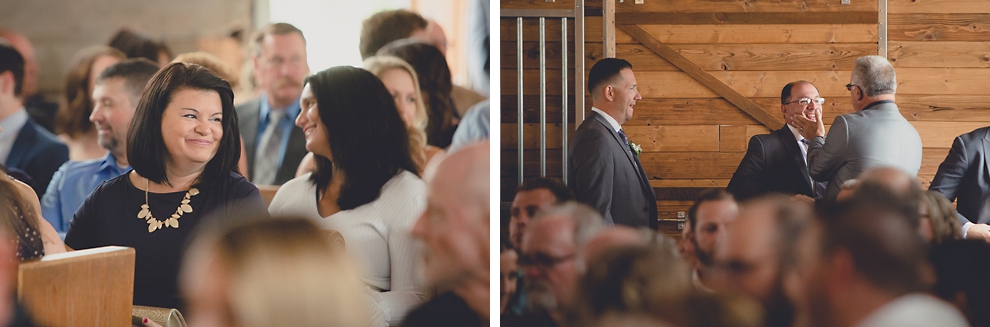 guests laughing at wedding ceremony in converted stables at a Hayloft in the Grove wedding in East Aurora, near Buffalo, NY