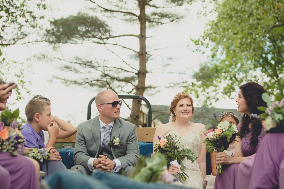 wedding party takes hayride to sunken pond for portraits at a Hayloft in the Grove in East Aurora, near Buffalo, NY