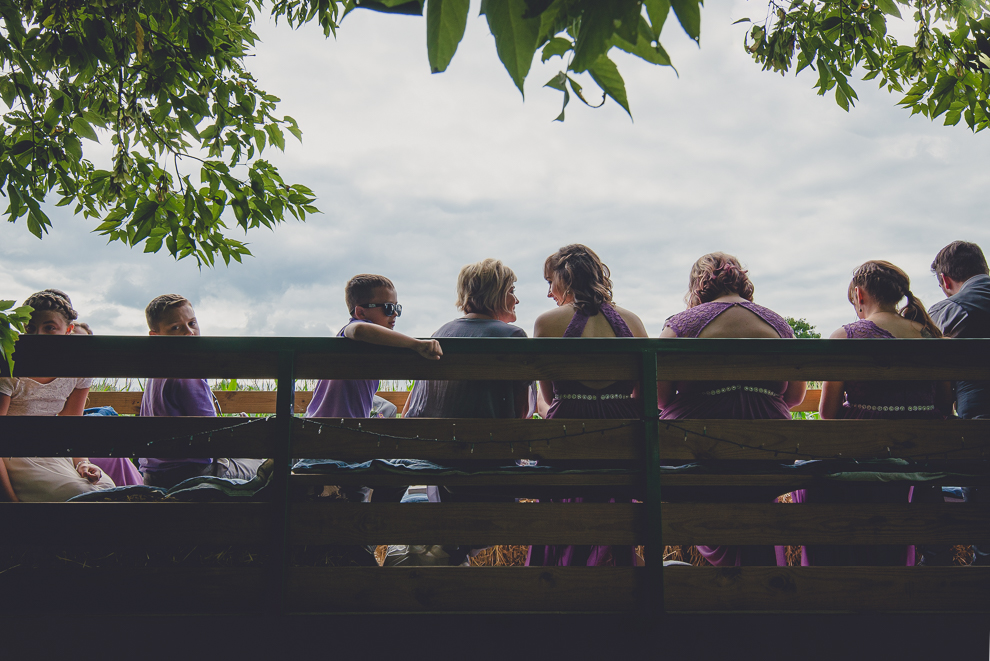wedding party takes hayride to sunken pond for portraits at a Hayloft in the Grove in East Aurora, near Buffalo, NY