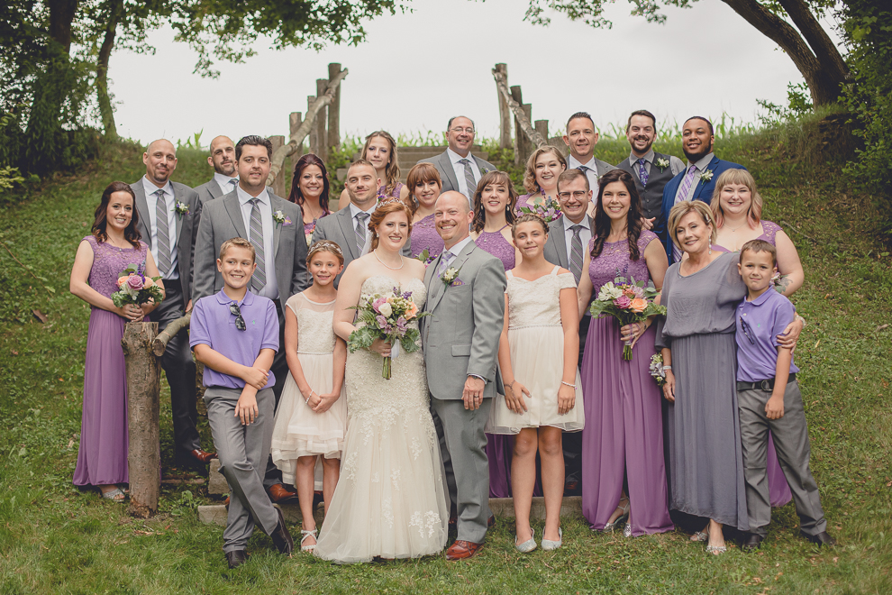 wedding party poses for portraits at sunken pond at a Hayloft in the Grove in East Aurora, near Buffalo, NY