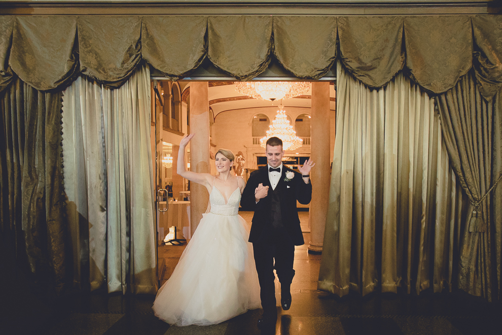 bride and groom enter in Terrace Room at the Statler City wedding reception venue in Buffalo, NY