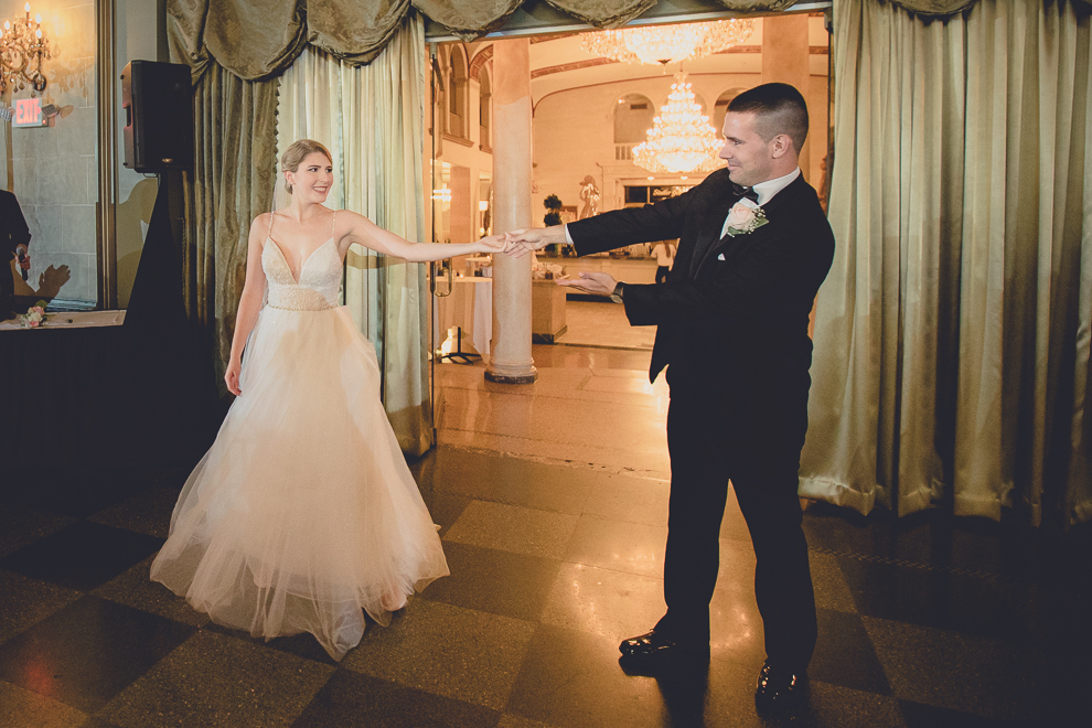 bride and groom enter in Terrace Room at the Statler City wedding reception venue in Buffalo, NY