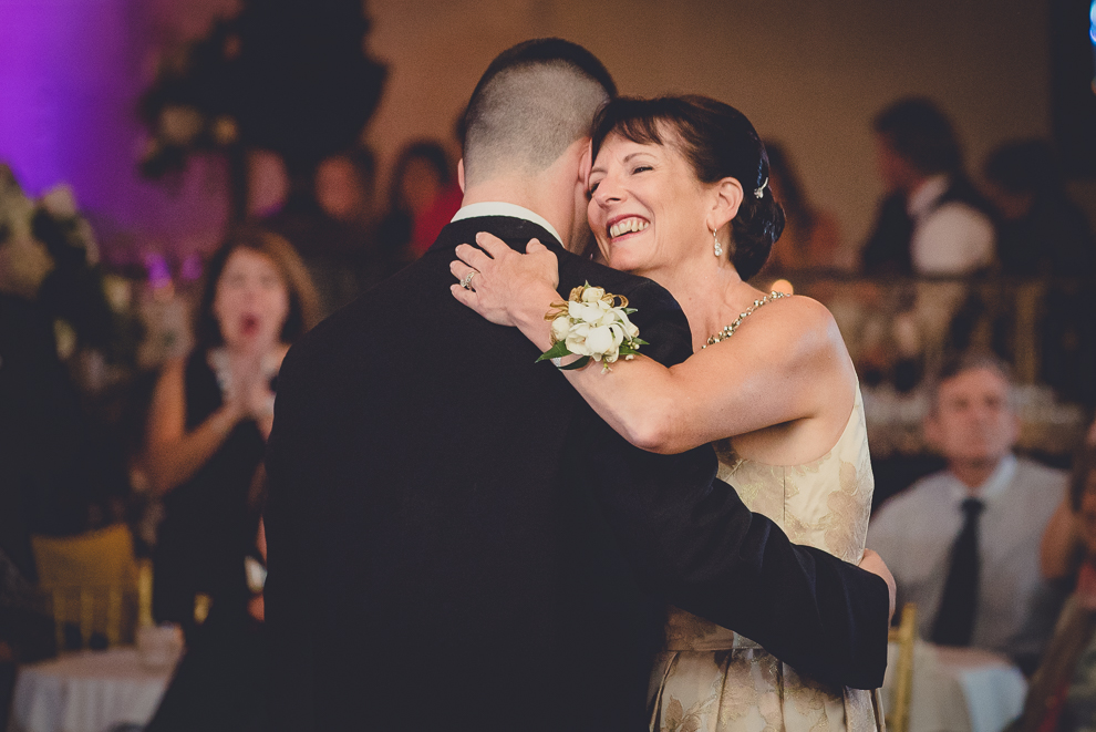 mother hugs groom after dance in Terrace Room at the Statler City wedding reception venue in Buffalo, NY