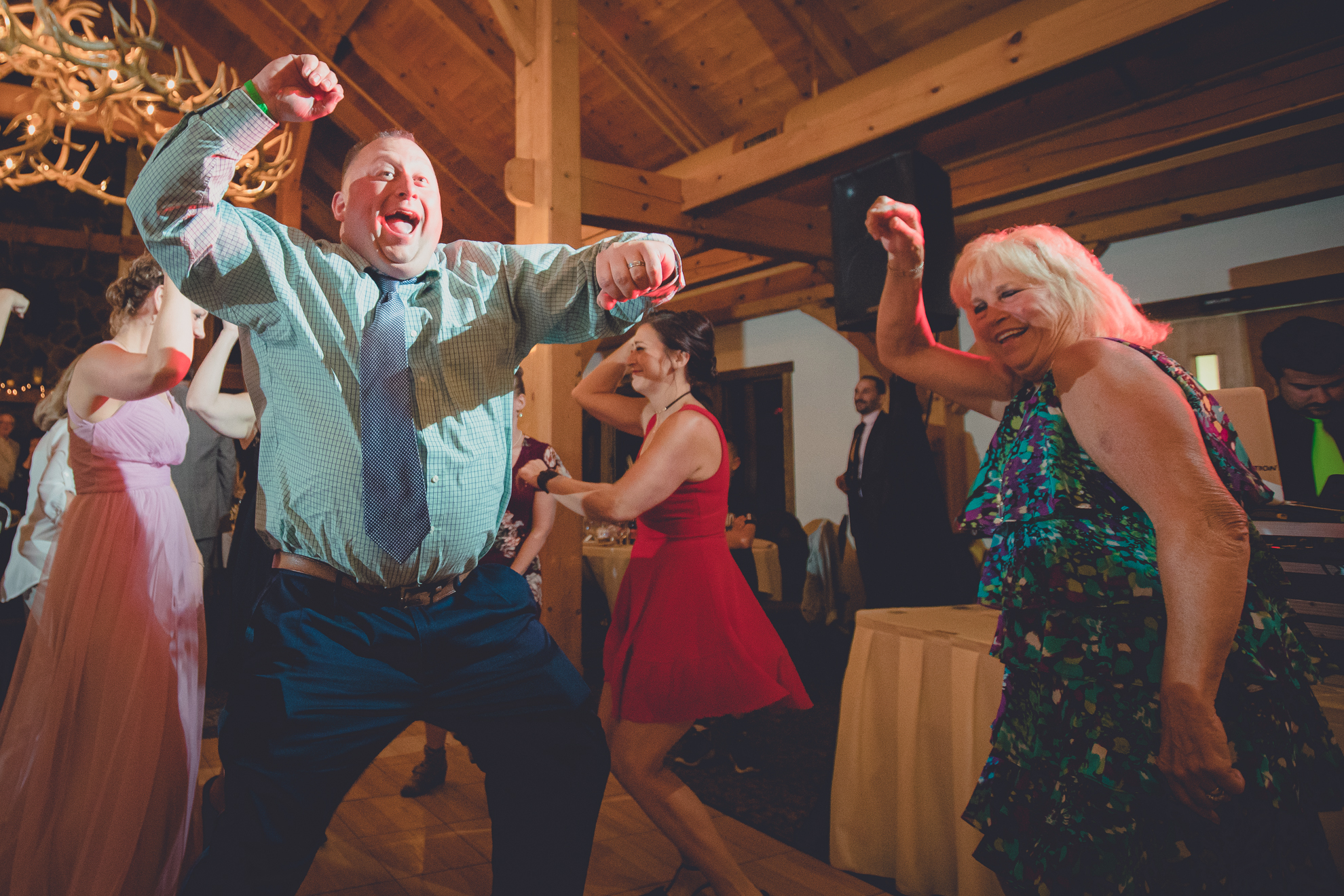 guests dance in lodge at wedding at hidden valley animal adventure near Buffalo, NY