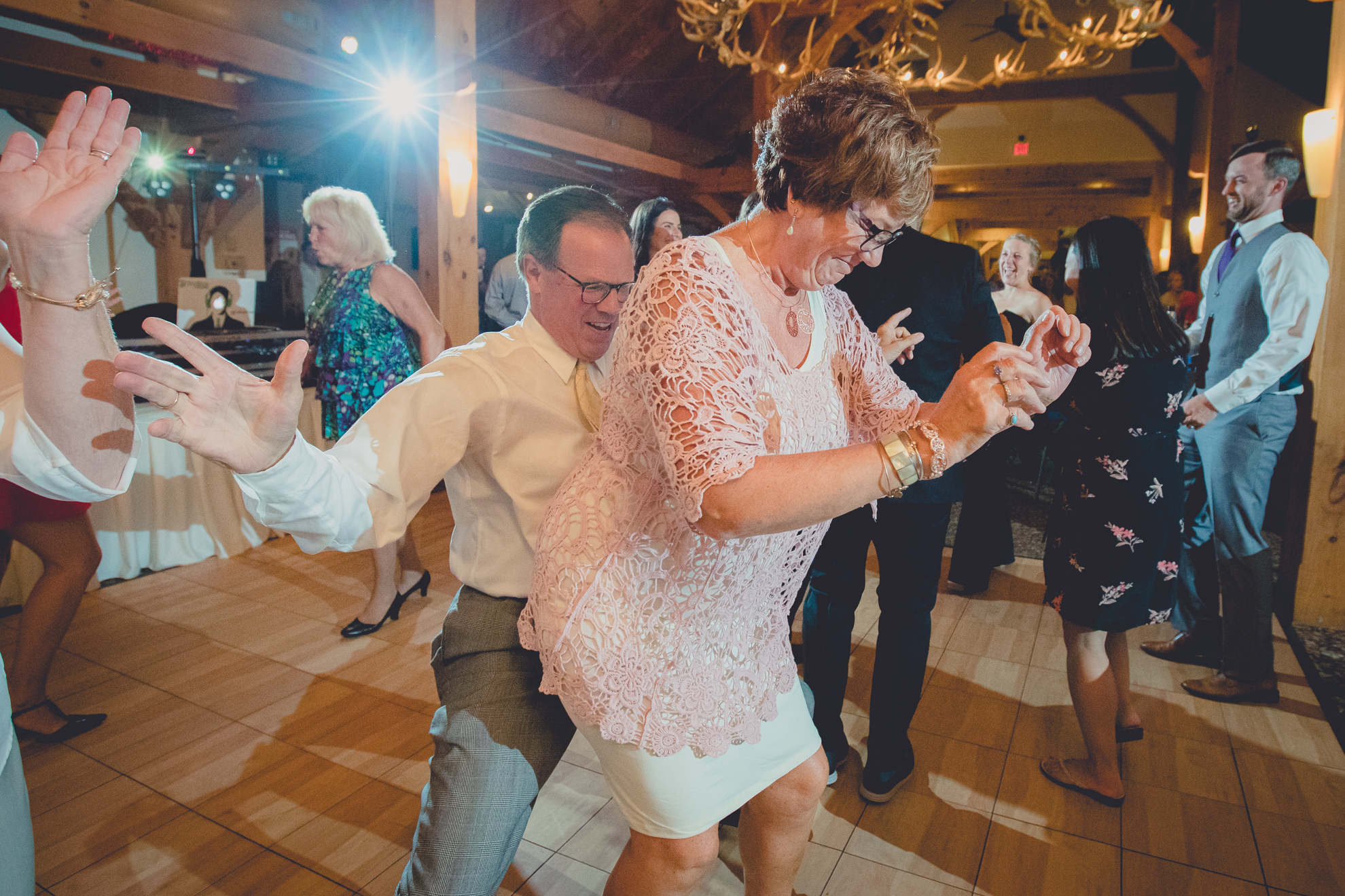 guests dance in lodge at wedding at hidden valley animal adventure near Buffalo, NY