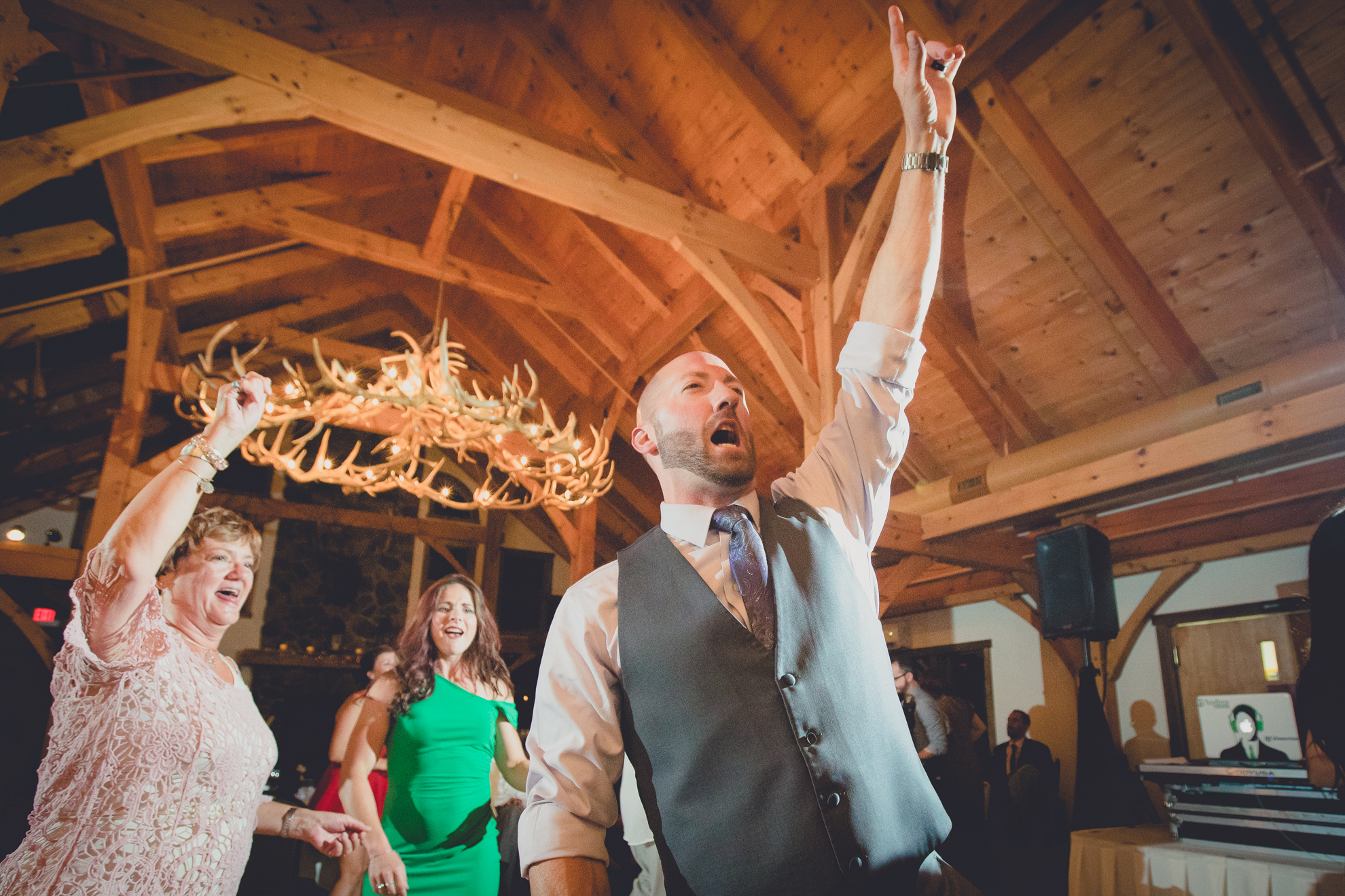 guests dance in lodge at wedding at hidden valley animal adventure near Buffalo, NY