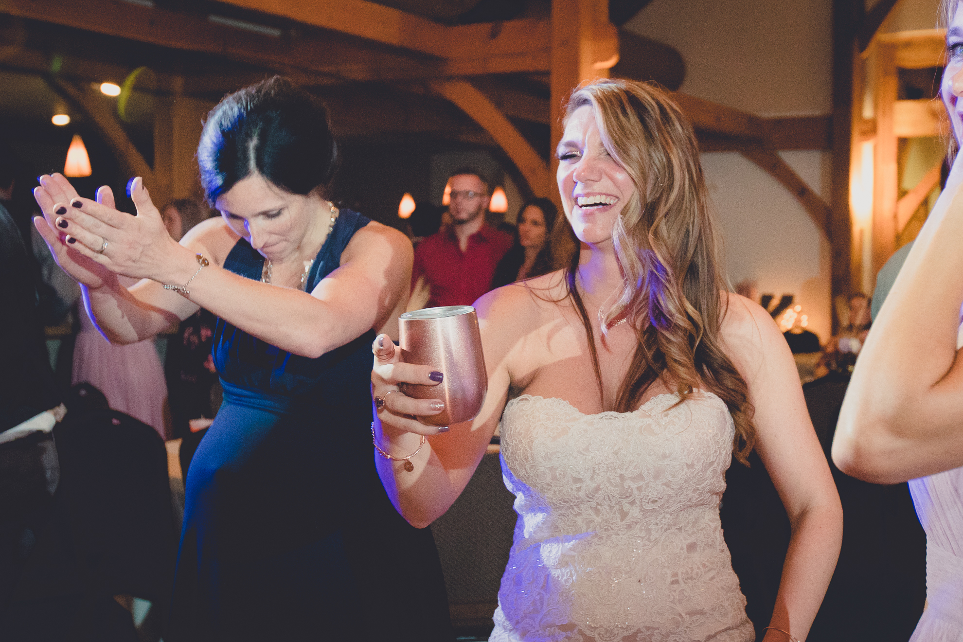 guests dance in lodge at wedding at hidden valley animal adventure near Buffalo, NY
