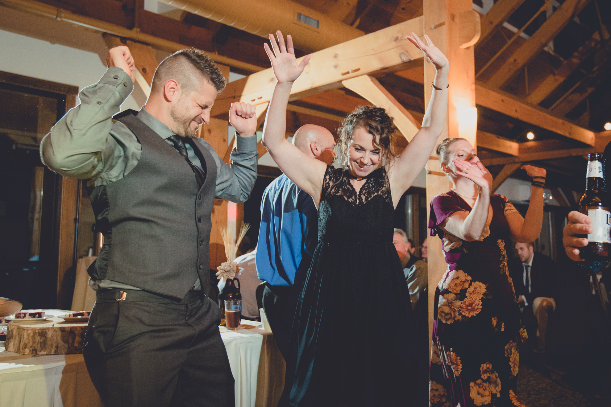 guests dance in lodge at wedding at hidden valley animal adventure near Buffalo, NY