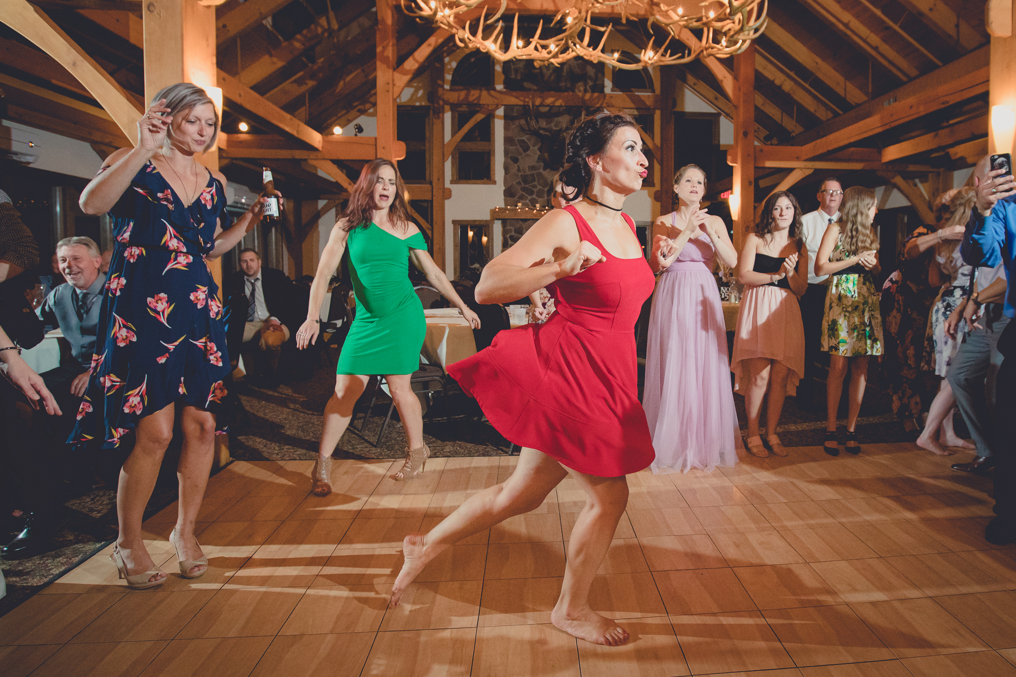 guests dance in lodge at wedding at hidden valley animal adventure near Buffalo, NY