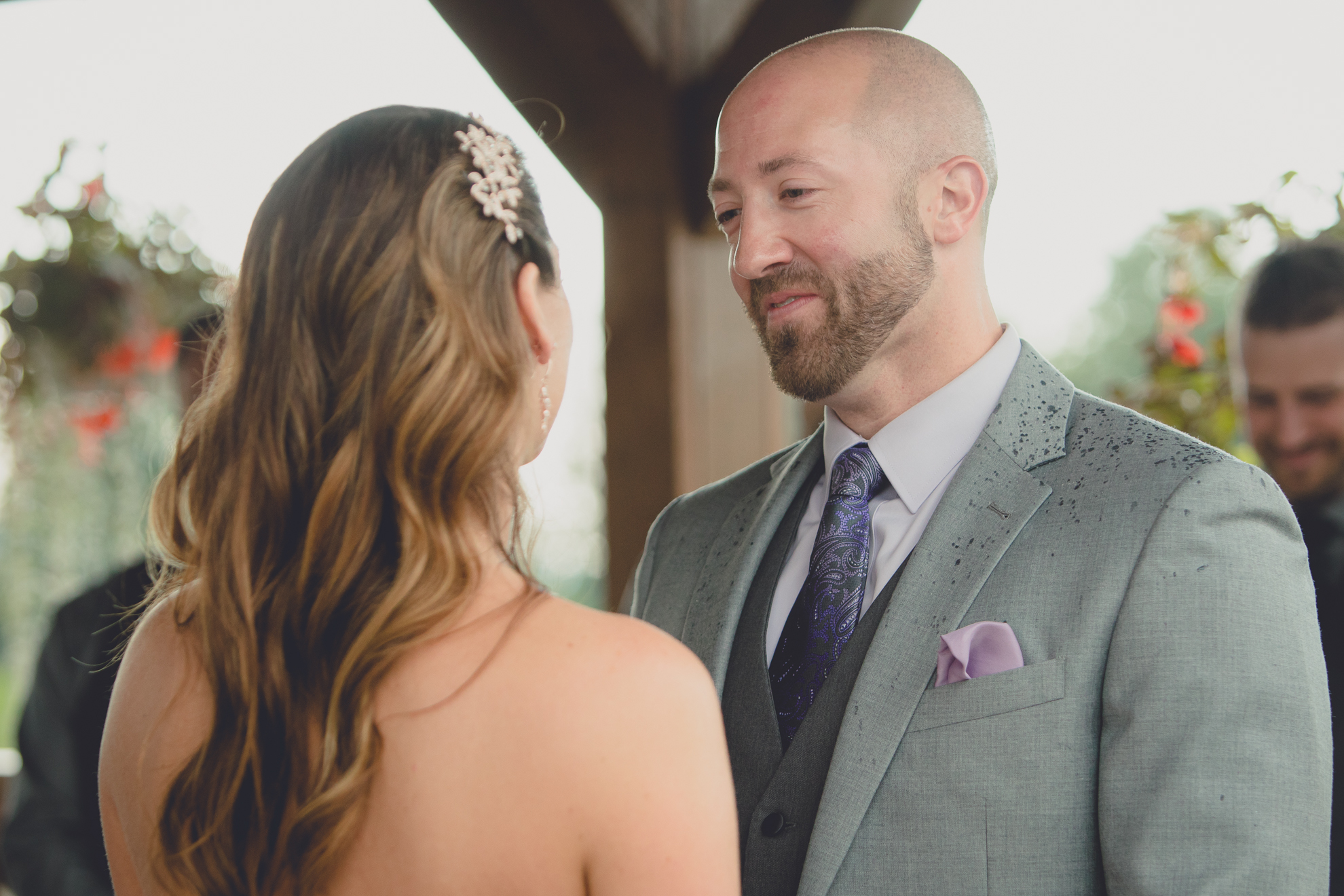 photography of bride and groom exchanging vows at wedding ceremony at hidden valley animal adventure near Buffalo, NY
