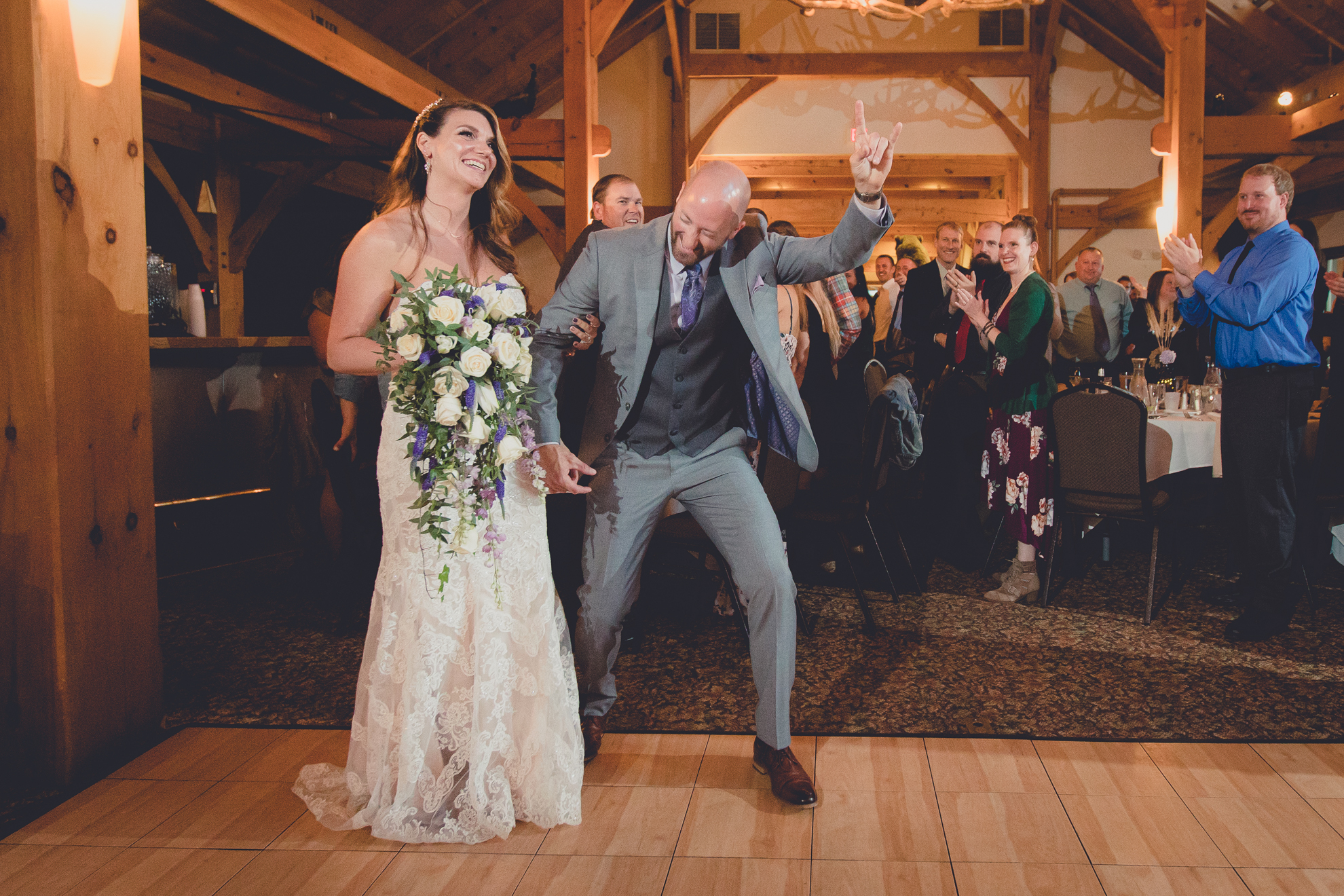 bride and groom dance in lodge at their wedding at hidden valley animal adventure near Buffalo, NY