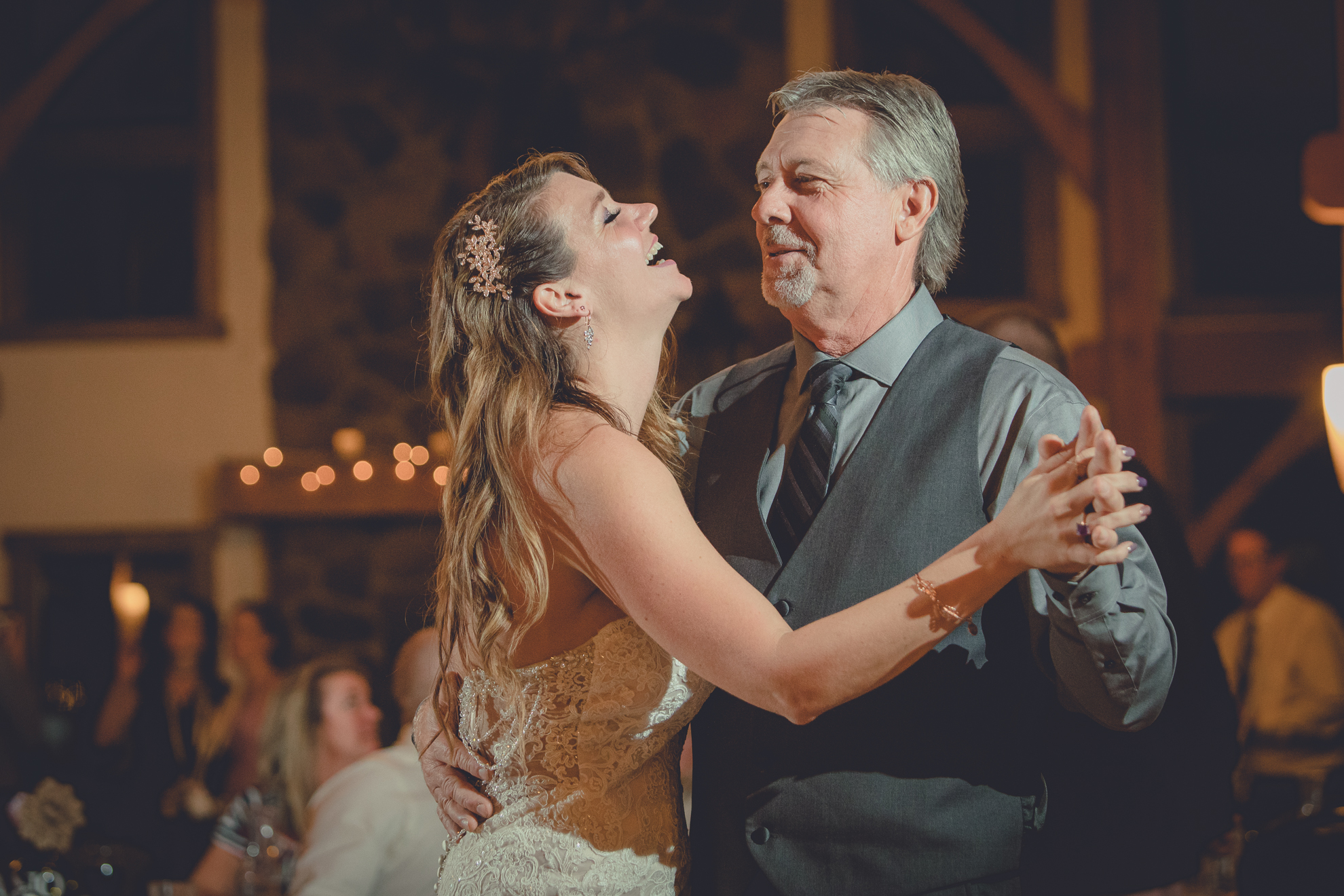 bride dances with father in lodge at wedding at hidden valley animal adventure near Buffalo, NY