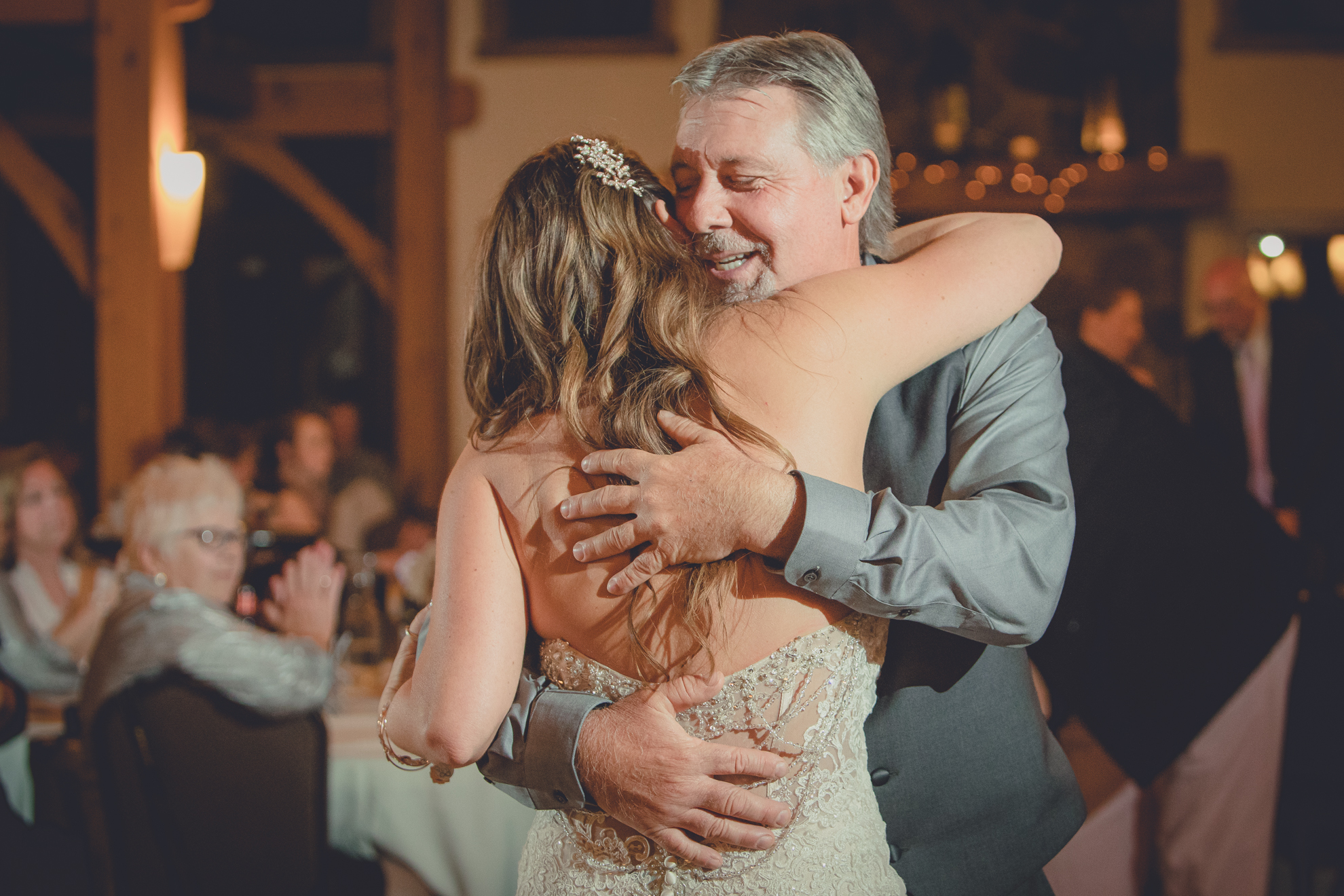 bride dances with father in lodge at wedding at hidden valley animal adventure near Buffalo, NY