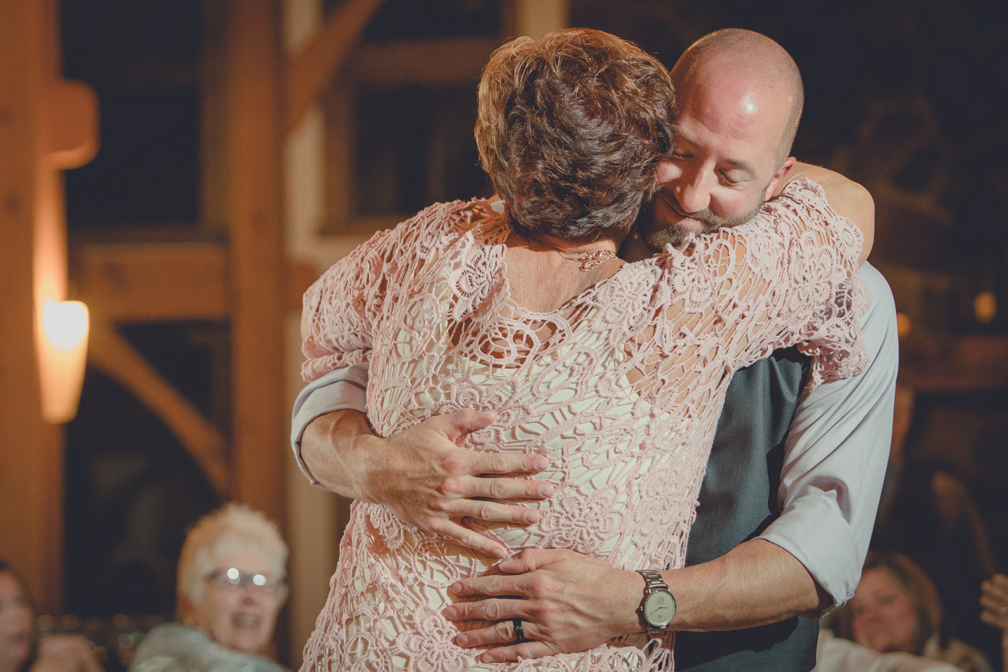 groom dances with mother in lodge at wedding at hidden valley animal adventure near Buffalo, NY