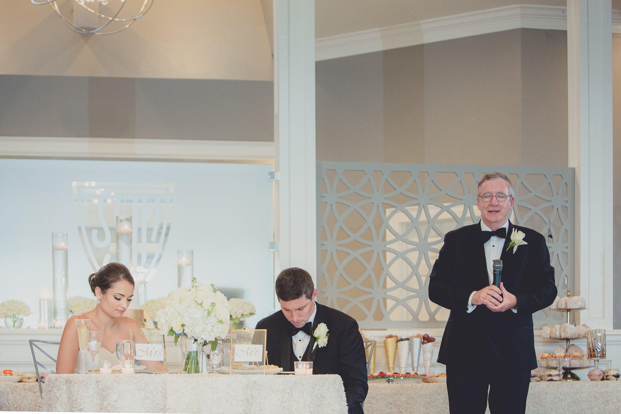 father of groom delivers prayer at wedding reception at Niagara Falls Country Club in Lewiston, NY