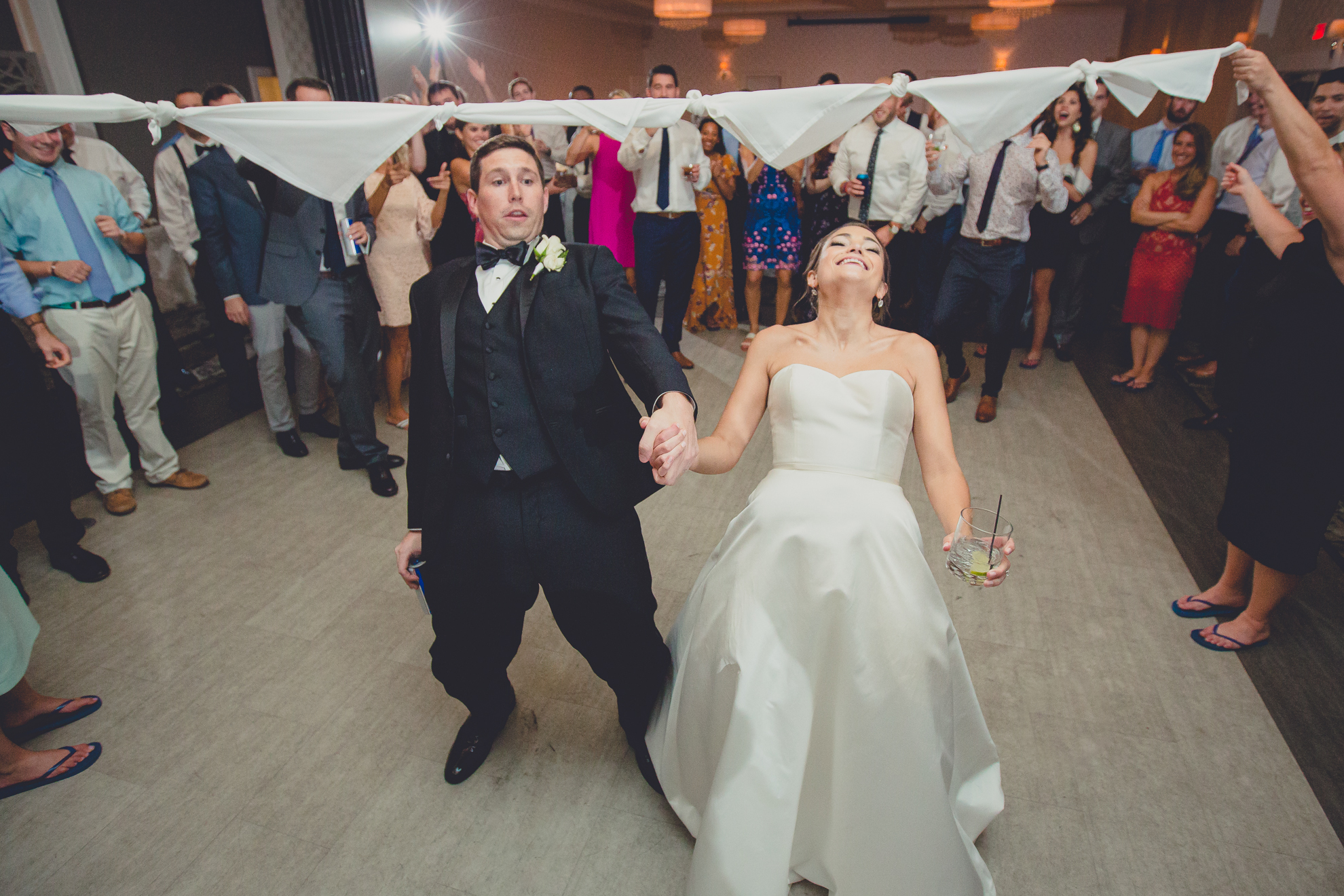 bride and groom limbo at wedding reception at Niagara Falls Country Club in Lewiston, NY