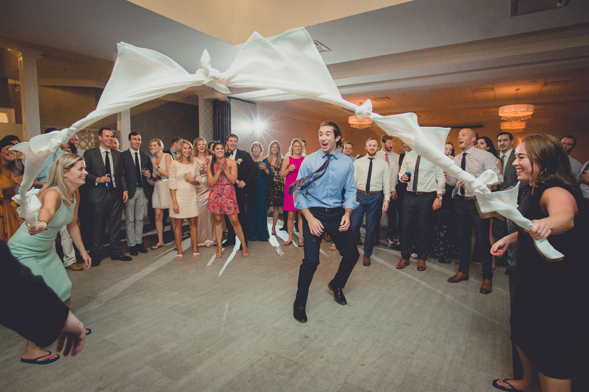 guests limbo at wedding reception at Niagara Falls Country Club in Lewiston, NY
