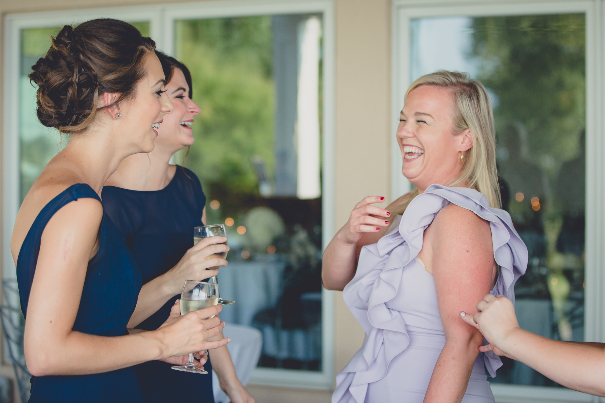 guests laugh at wedding reception at Niagara Falls Country Club in Lewiston, NY