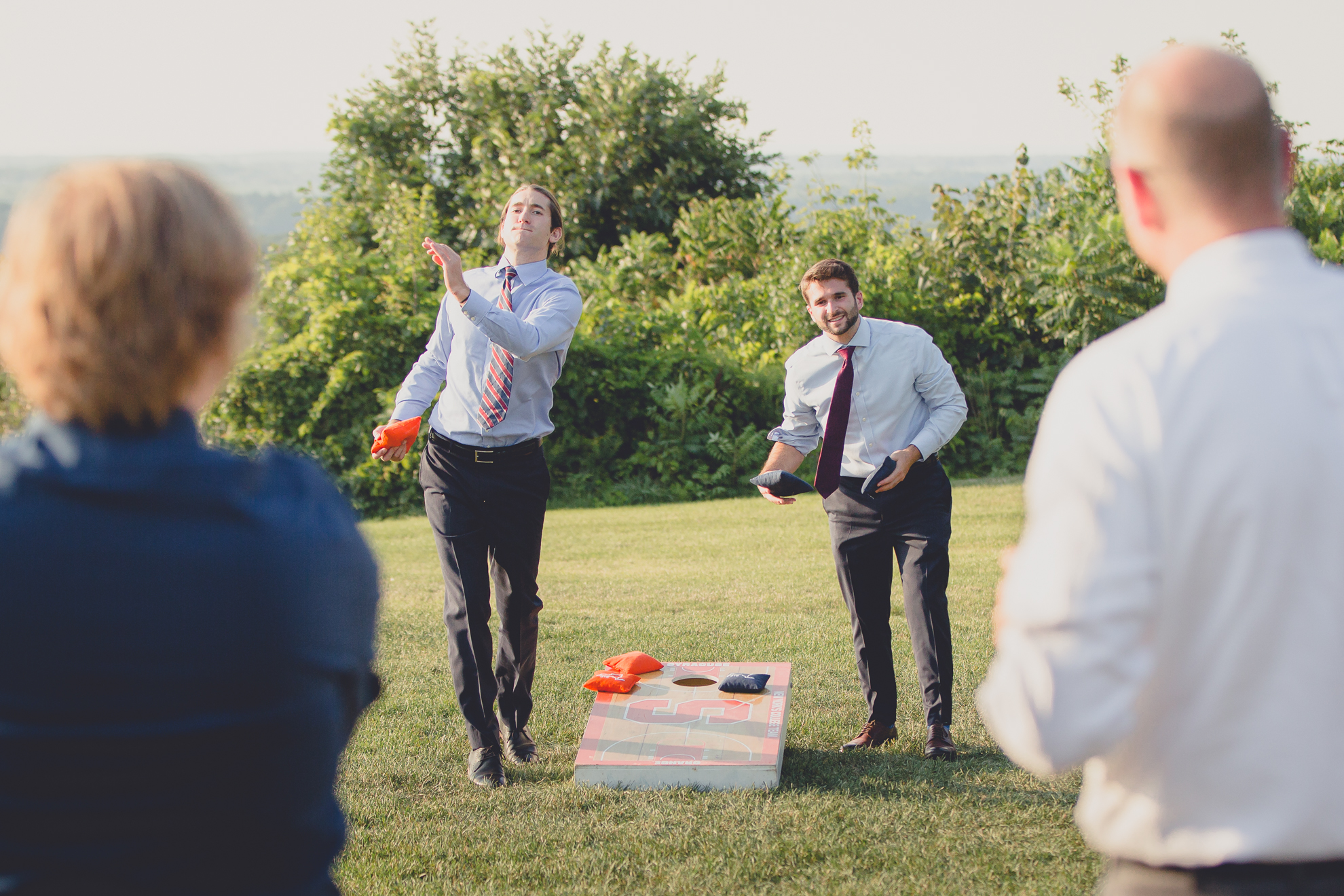 guests play lawn games at wedding reception at Niagara Falls Country Club in Lewiston, NY