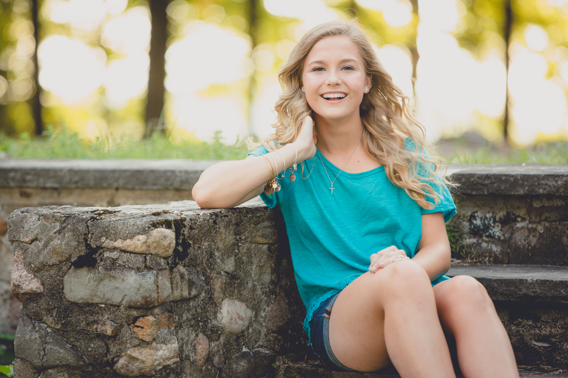 Dana smiles for portrait during her senior session in Long Point State Park near Buffalo, NY