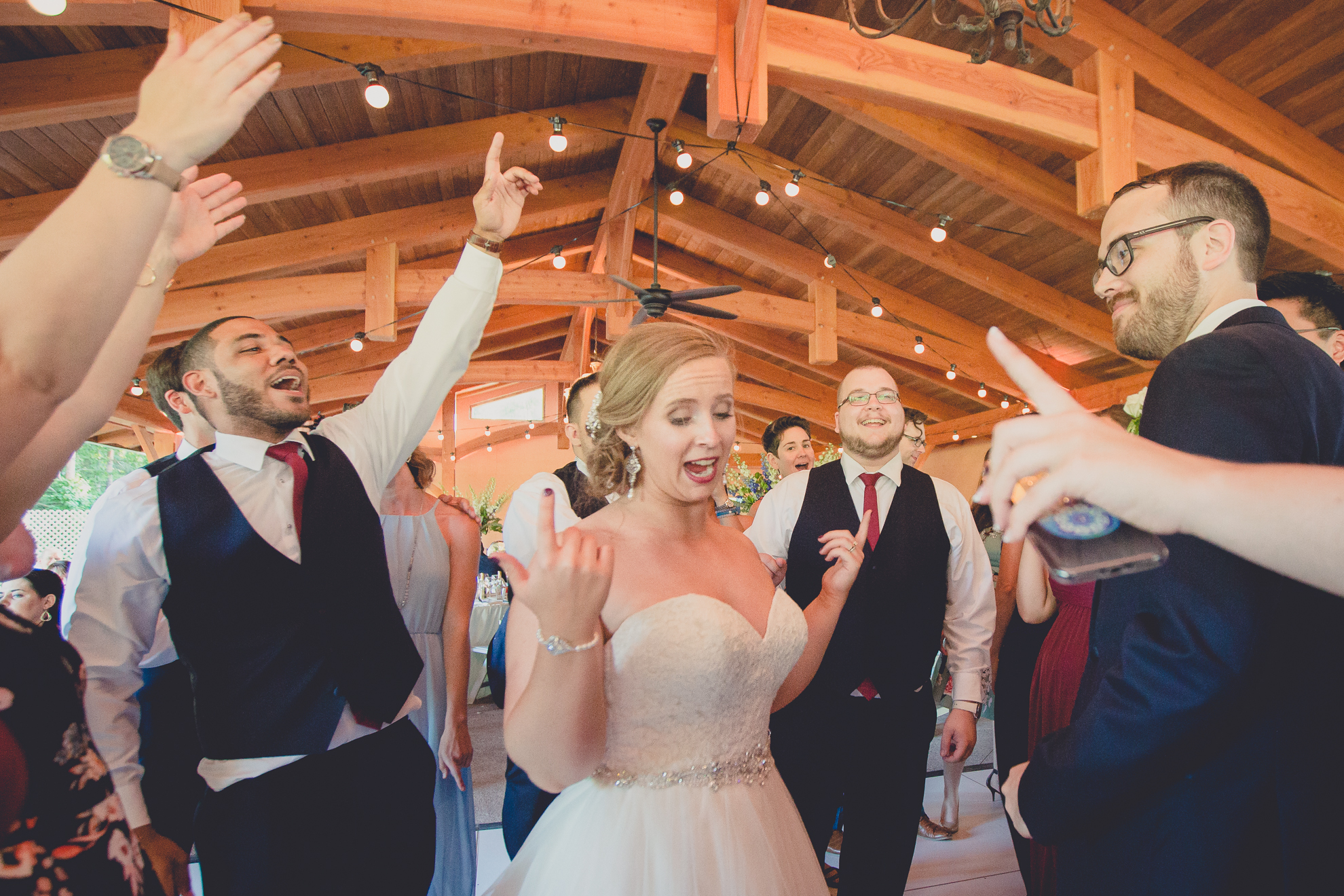 guests dance during outdoor wedding reception at Spring Lake Winery venue near Buffalo in WNY