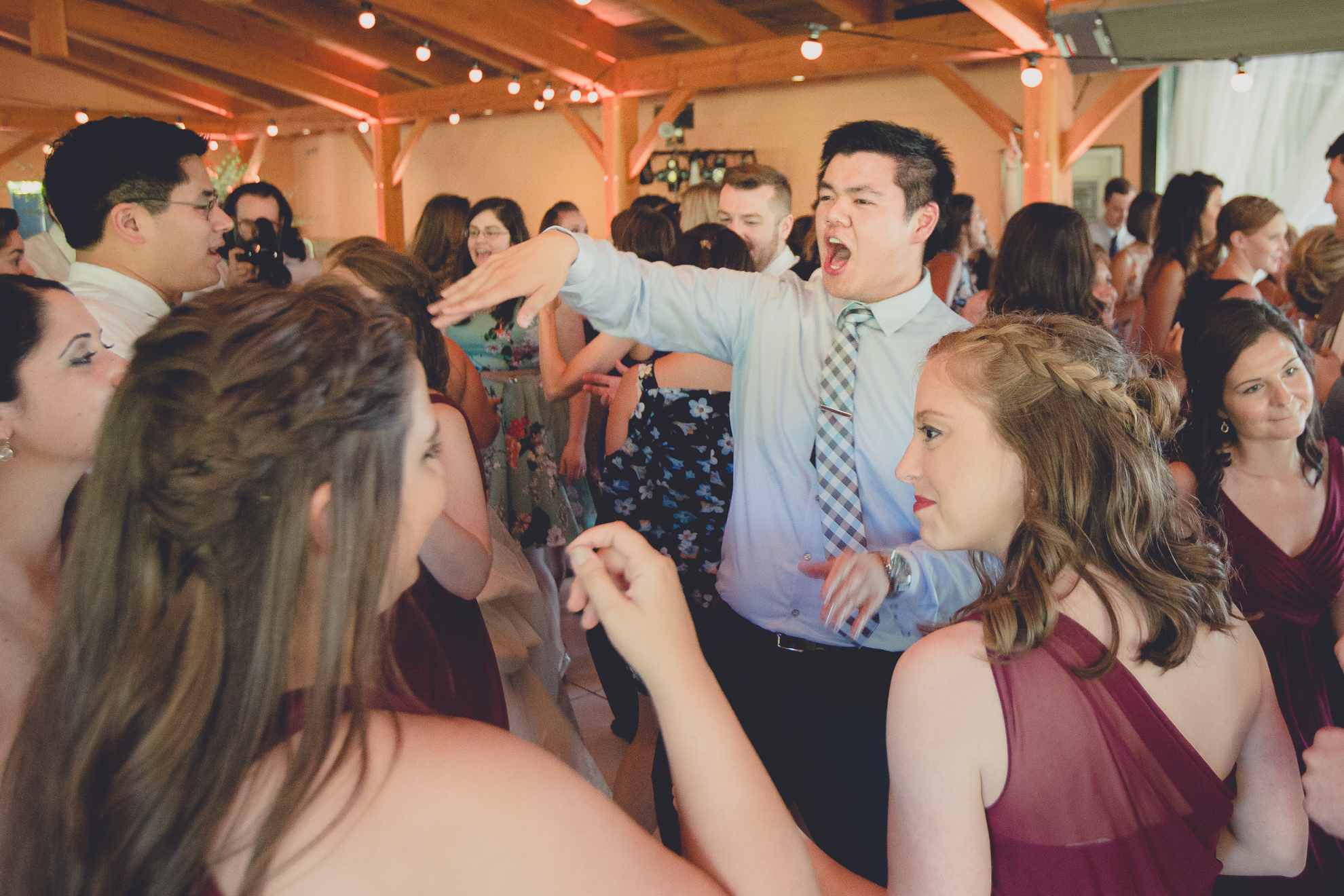 guests dance during outdoor wedding reception at Spring Lake Winery venue near Buffalo in WNY