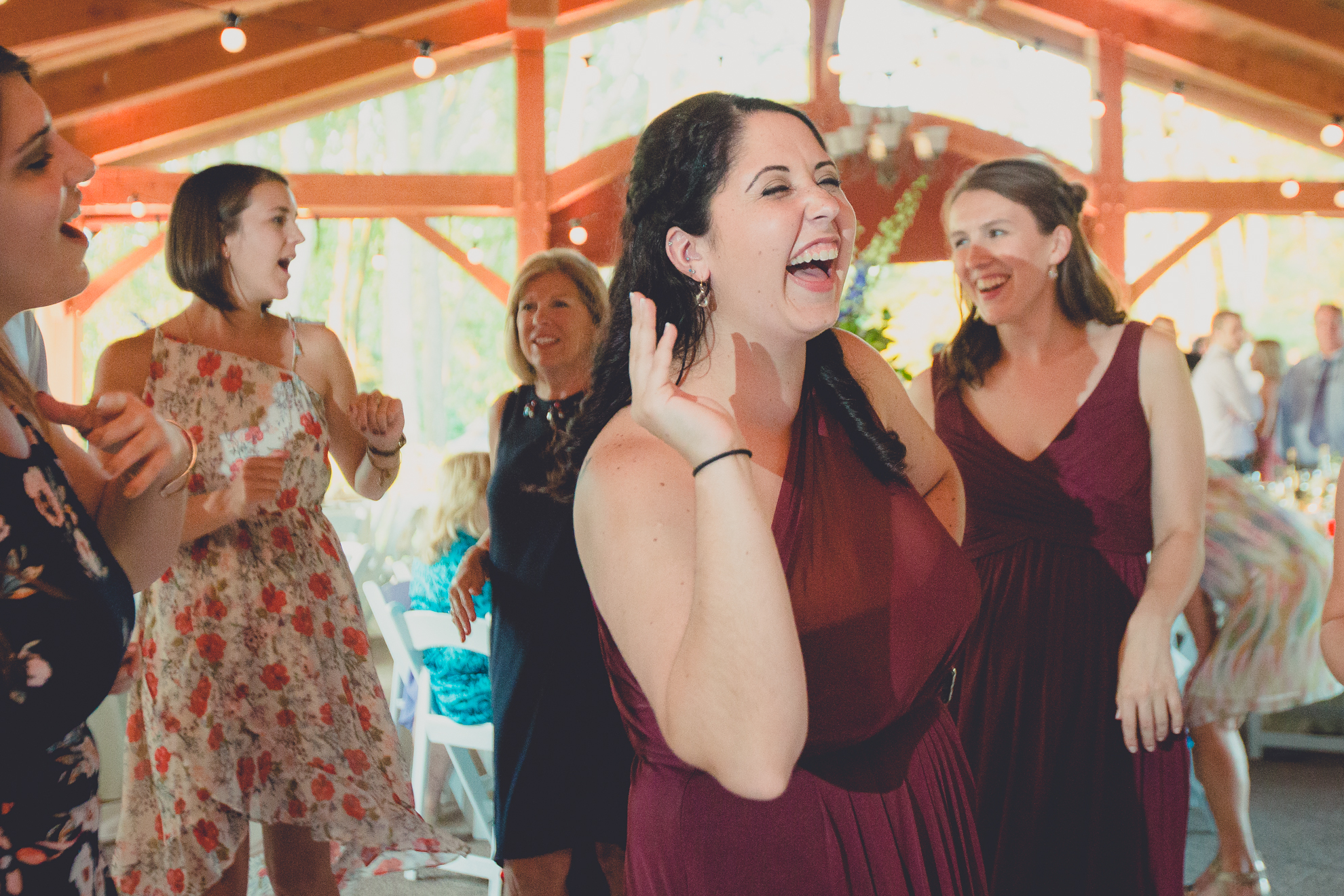 guests dance during outdoor wedding reception at Spring Lake Winery venue near Buffalo in WNY