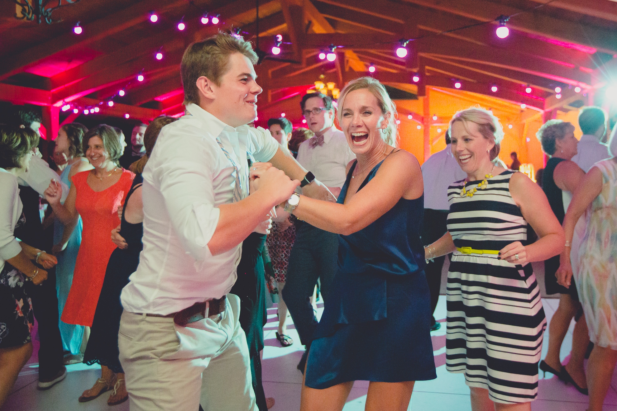 guests dance during outdoor wedding reception at Spring Lake Winery venue near Buffalo in WNY
