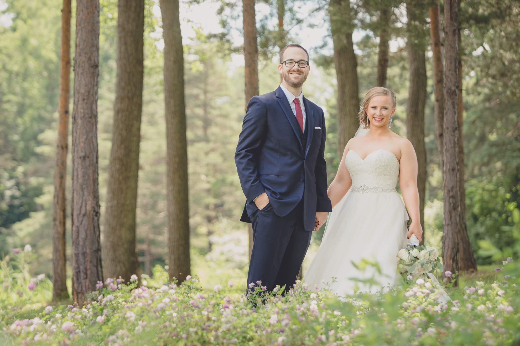 bride and groom smile for photographer at Spring Lake Winery in Niagara County before WNY wedding