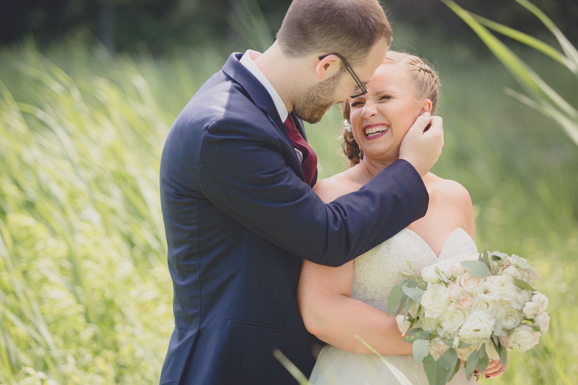 bride and groom pose for portrait at Spring Lake Winery in Niagara County before WNY wedding