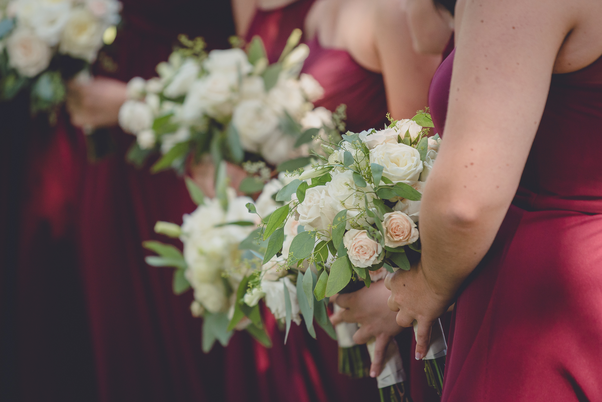 bouquets being held by bridesmaids at Spring Lake Winery in Niagara County before WNY wedding