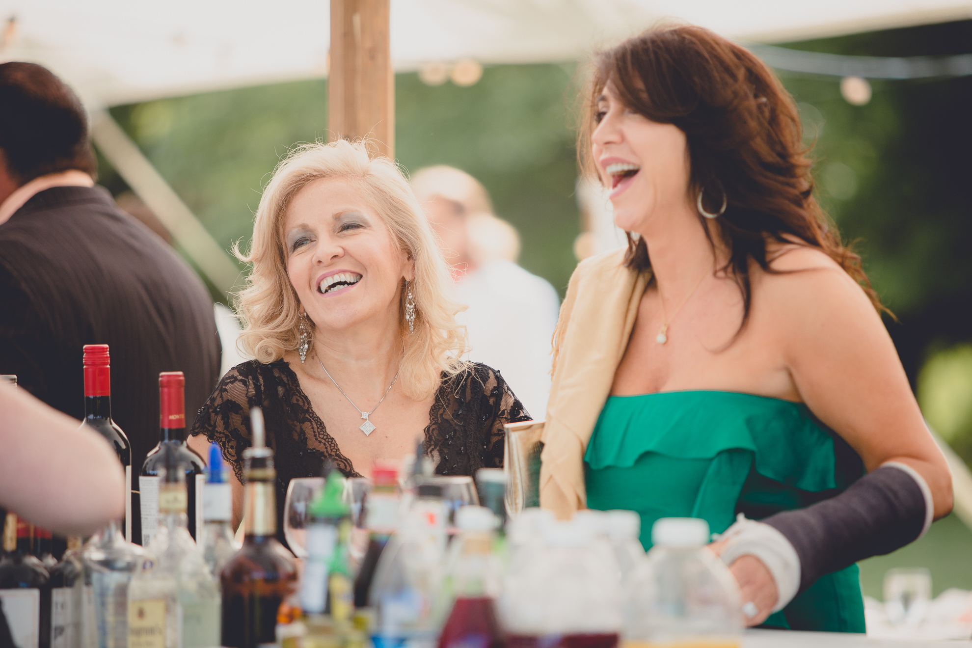 guest enjoy cocktail hour in tent at reception at small wedding at Knox Farm near Buffalo, NY